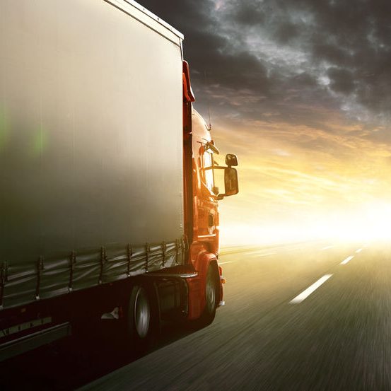 Truck driving into sunset Truck driving into sunset